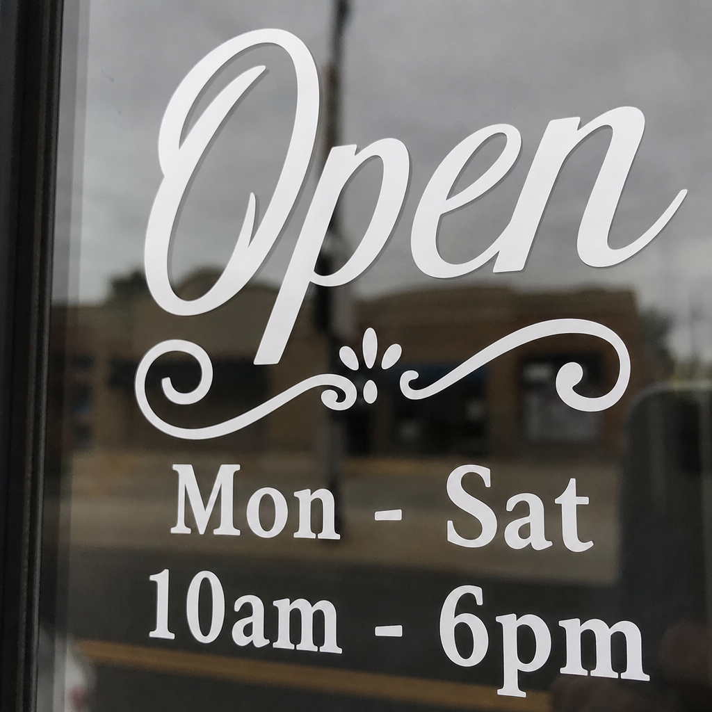 window vinyl displaying hours of operation